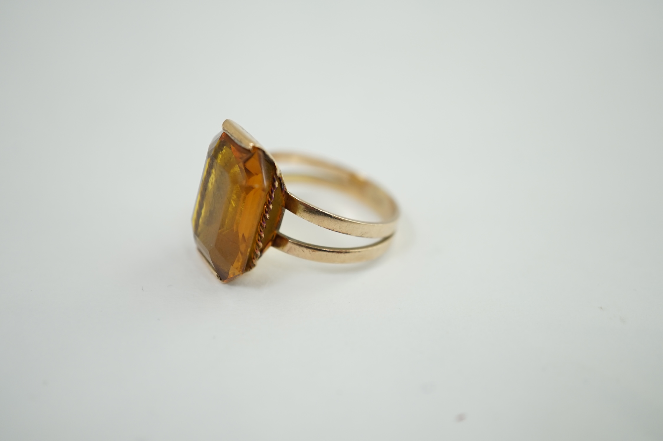 A mid to late 20th century gold and single stone octagonal cut synthetic? sapphire set dress ring, size P, gross weight 6.8 grams. Condition - poor to fair